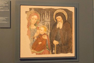 Madonna and Child and Sant'Antonio Abate, XV century, is a wall paintings detachment in Santa Giulia museum, Brescia, Lombardy, Italy. clipart
