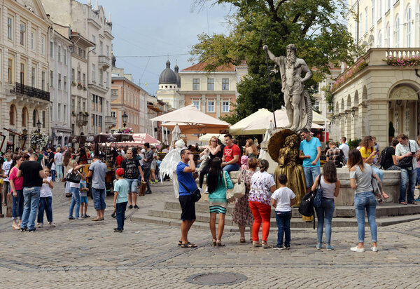 Crowds of tourists on Rynok Square in Lviv.