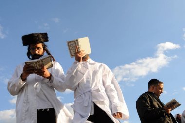 Orthodox Jewish pilgrims  during the celebrating Rosh Hashanah, the Jewish New Year in Uman, Ukraine. clipart