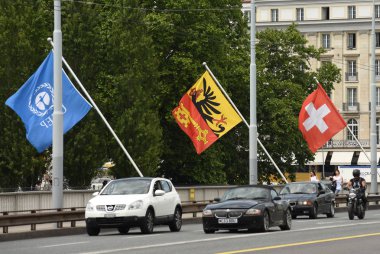 Swiss Flag and Flag of Geneva on the bridge in Geneva, Switzerland. clipart