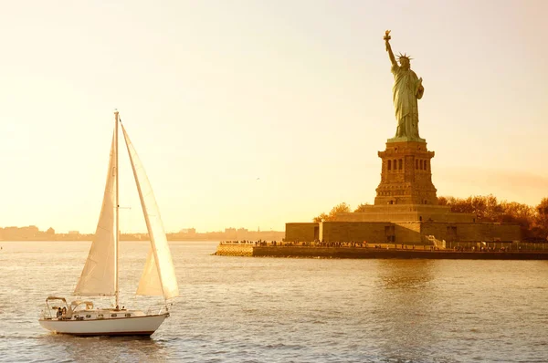 Statue of Liberty and yacht, New York City, NY, USA