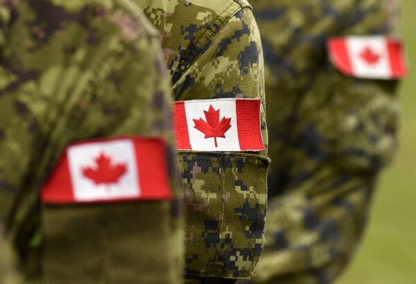 Flag of Canada on military uniform. Canadian soldiers. Army of Canada. Remembrance Day. Canada Day. Stock Image