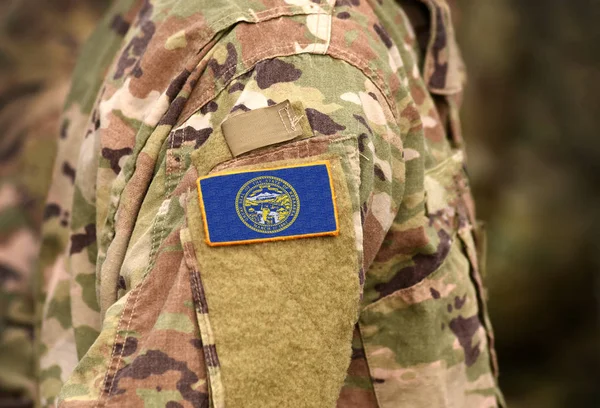 Bandera del Estado de Nebraska en uniforme militar. Estados Unidos . — Foto de Stock