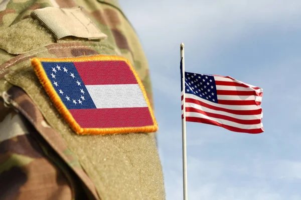 Flag of the Confederate States of America (1861-1863) on military uniform and Flag of USA weaving in the sky. American Civil War. — ストック写真