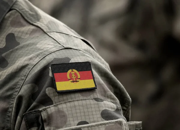 Flag of East Germany on military uniform. German Democratic Republic (DDR). Collage. — 스톡 사진