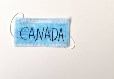Kanada yazılı koruyucu tıbbi maske. C 'de karantina