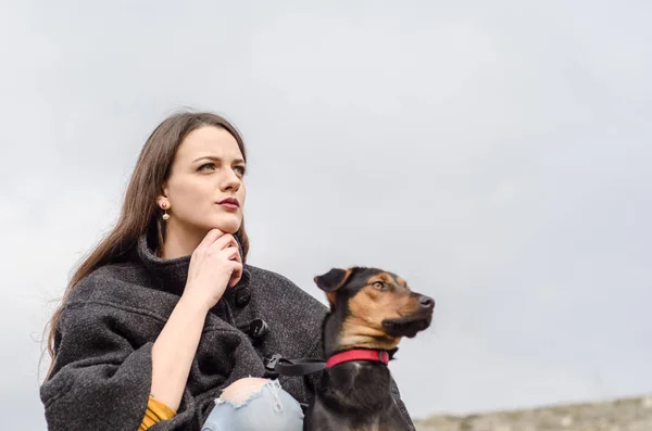 Person standing with his devoted and faithful dog outdoors — Stock Photo, Image