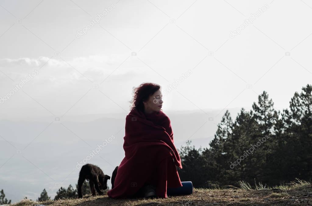 Girl and dog on the mountain