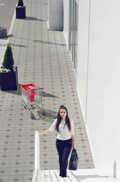 woman climbs the stairs