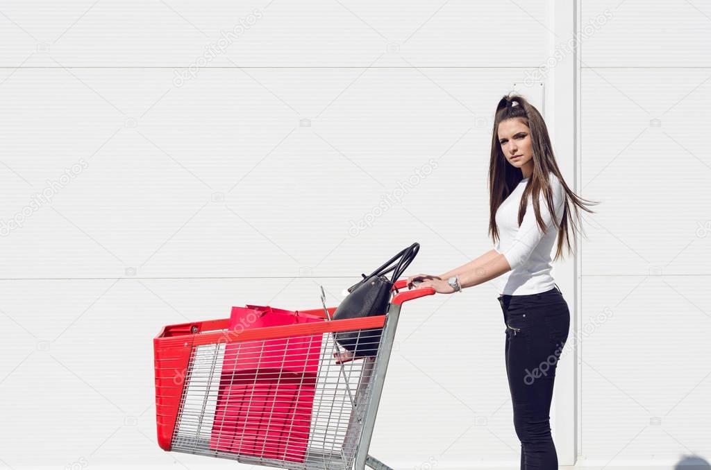 woman pushing a shopping trolley