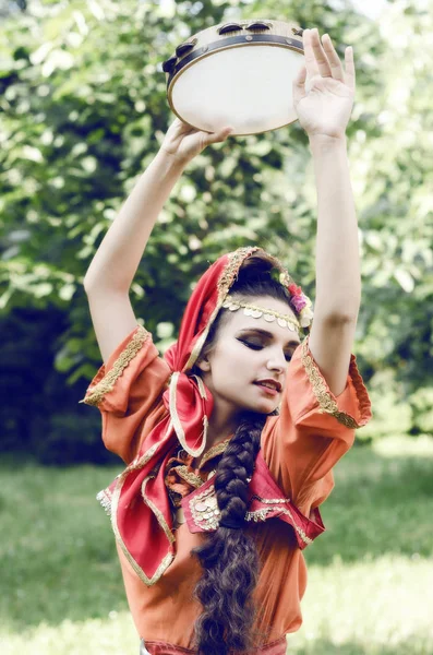 Gypsy dances with tambourine — Stock Photo, Image