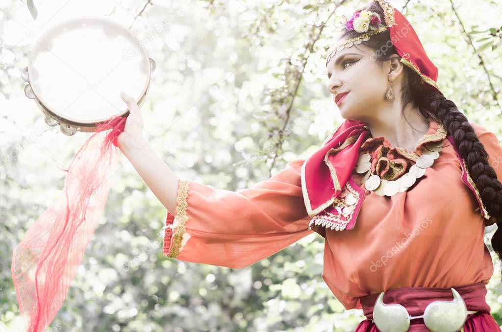 girl in folk costume dances