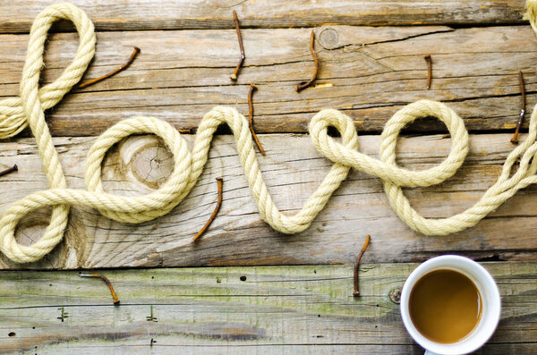 Written text date with rope on old wood