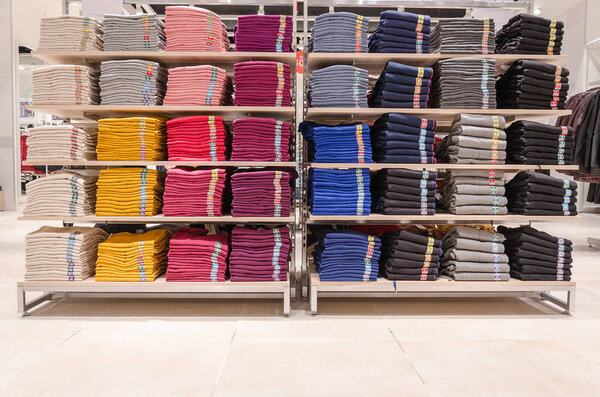 shelves with colorful T-shirts 