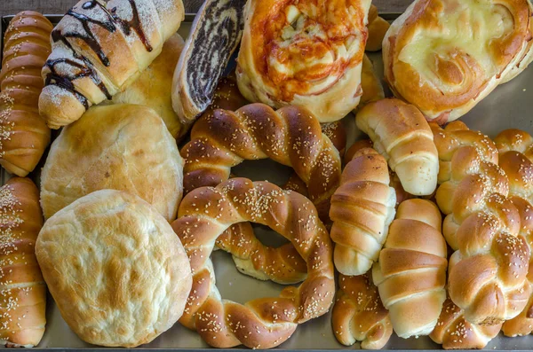 Lots of pastries, breads and dough — Stock Photo, Image