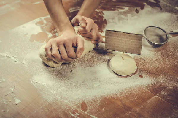 Woman pressing dough — Stock Photo, Image