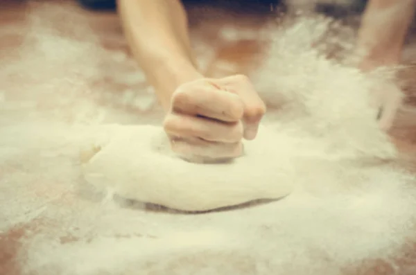 Female fist in motion stroke dough — Stock Photo, Image