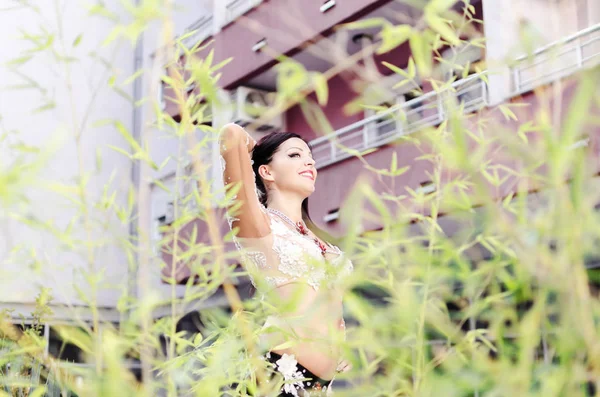 Woman in nature dancing and smiling — Stock Photo, Image