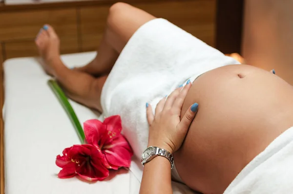 Pregnant woman waiting for massage — Stock Photo, Image