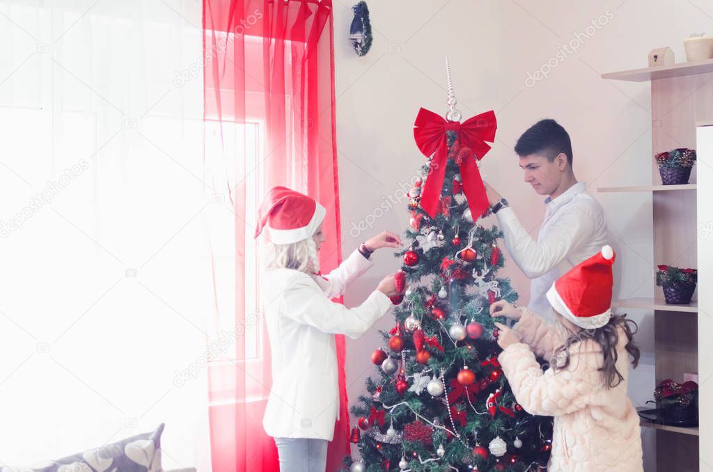 Happy young family celebrating Christmas