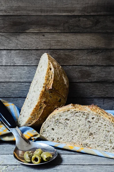 Fresh baked olive bread from oven, Focaccia bread with olives on wooden background