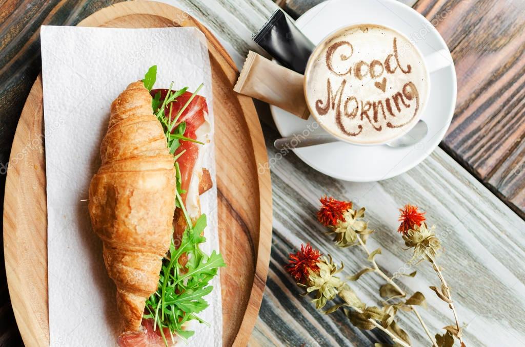 breakfast with fresh bacon croissants and coffee