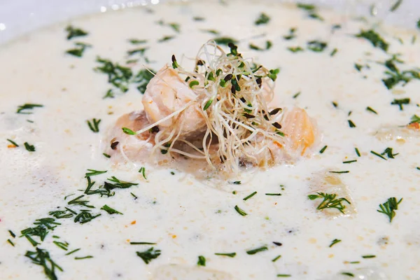 Healthy white cheese soup with salmon and microgreen seeds. Decorated with greenery. First course in the white plate. Closeup. — Stock Image Healthy White Cheese Soup Salmon Microgreen Seeds Decorated Greenery First Stock Picture