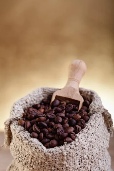 A small bag of coffee with scoop — Stock Photo, Image