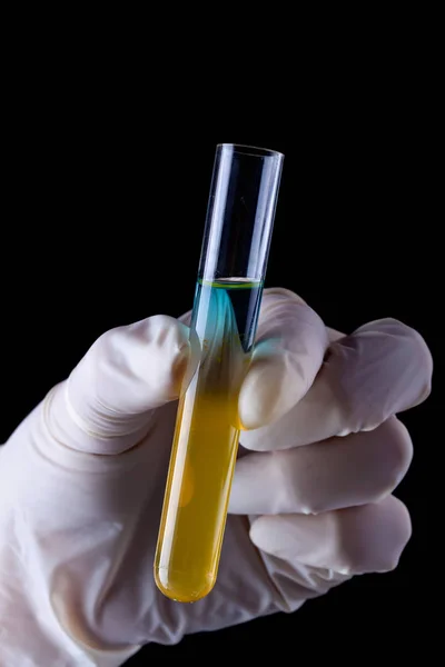 Sediments in chemical test tube - liquids separating — Stock Photo, Image