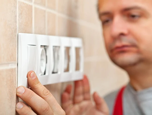 Electrician finished installing electrical wall socket - closeup — Stock Photo, Image