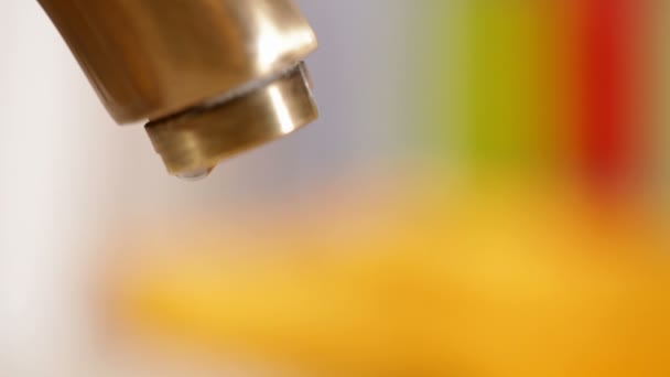 Closeup Dripping Faucet Colorful Background — Stock Video