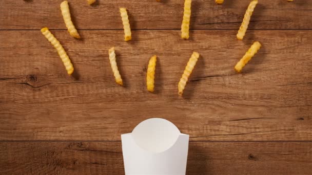 Stop Frame French Fries Falling Pouring Out Paper Bag Brown — Stock Video