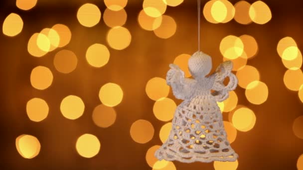 Two Crocheted Christmas Angels Decoration Hanging Blurred Lights Background — Stock Video