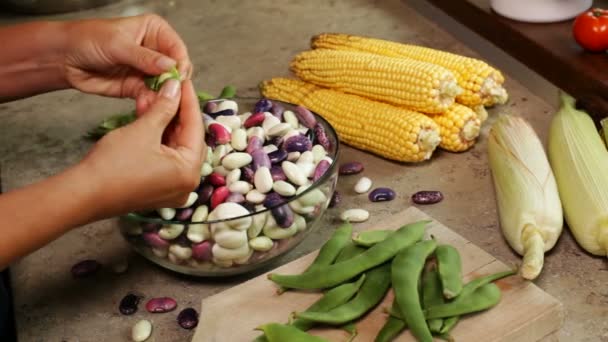 Close Female Hands Shelling Fresh Colorful Beans Glass Bowl Corn — Stock Video