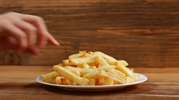Close Male Female Hands Taking French Fries Plate Wooden Background — Stock Video