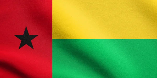 Bissau-Guinea zászlaja szövet állagú integetett — Stock Fotó