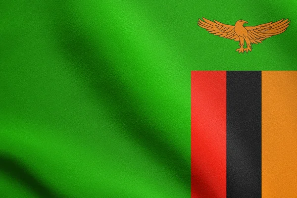 Flag of Zambia waving with fabric texture — Stock Photo, Image