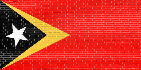 Vlag van Oost-Timor, bakstenen muur textuur achtergrond — Stockfoto