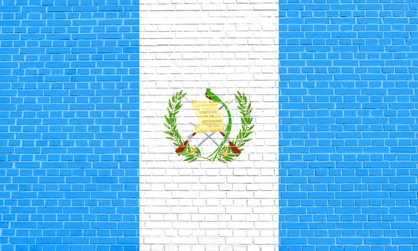 Bandeira da Guatemala no fundo textura parede de tijolo — Fotografia de Stock