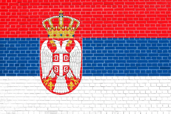 Bandeira da Sérvia na parede de tijolo textura fundo — Fotografia de Stock