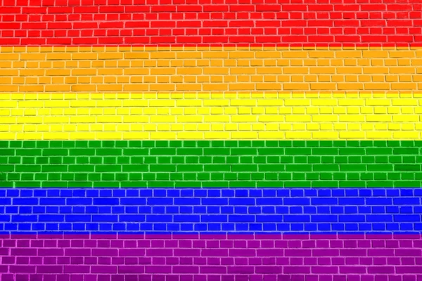 Rainbow gay pride flag on brick wall texture — Stock Photo, Image