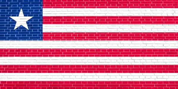 Bandeira da Libéria no fundo textura parede de tijolo — Fotografia de Stock