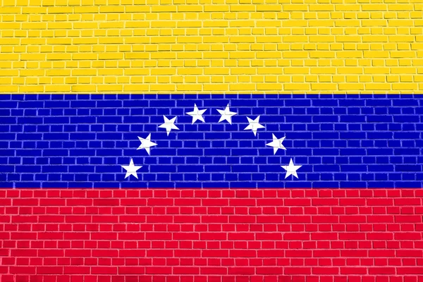Прапор Венесуели з цегляною текстурою стіни фону — стокове фото
