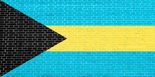 Vlajka Baham na pozadí textury cihlové zdi — Stock fotografie