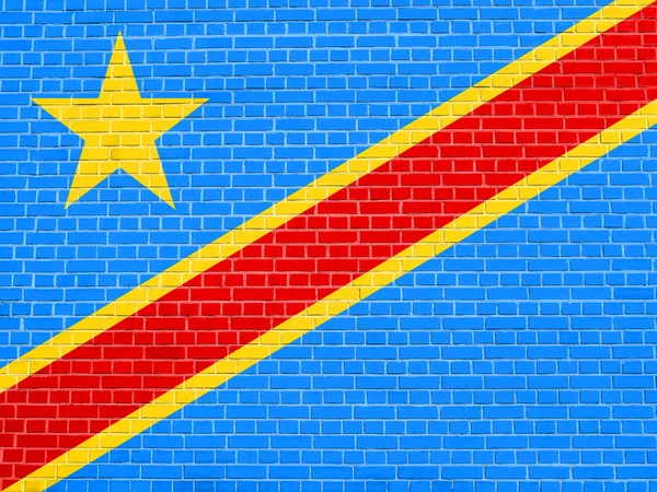 Vlajka doktora Kongo na pozadí textury cihlové zdi — Stock fotografie
