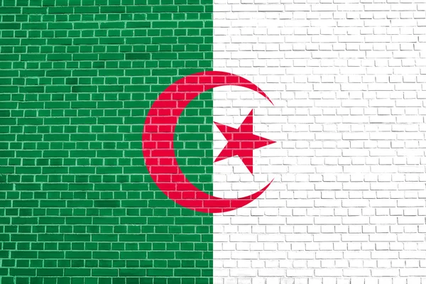 Algéria zászlaja a téglafalak textúráját jelző háttérrel — Stock Fotó