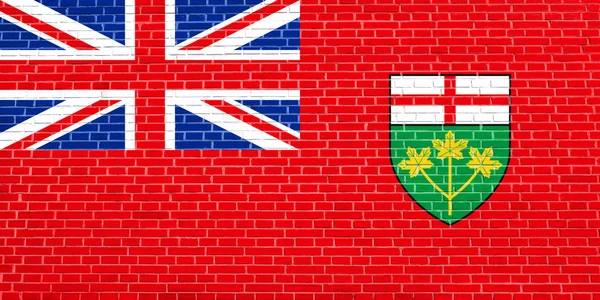 Vlajka Ontariu na pozadí textury cihlové zdi — Stock fotografie