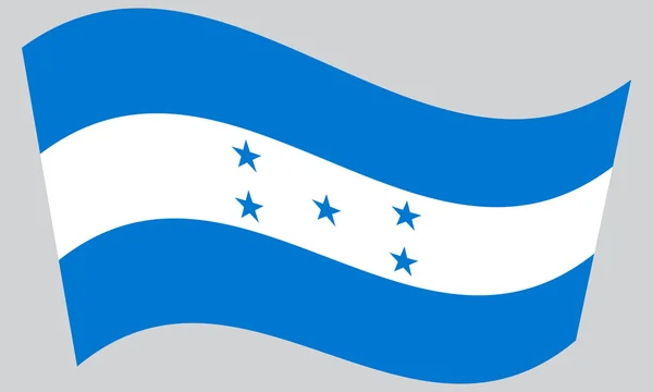 Bandera de Honduras ondeando sobre fondo gris — Vector de stock