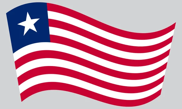 Flag of Liberia waving on gray background — Stock vektor