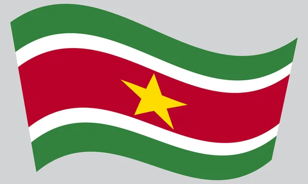 Flag of Suriname waving on gray background — Stock Vector